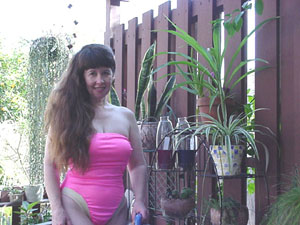 Dangerous Curves enjoys her porch as she waters all her plants. She keeps them
 all nice and, uh, moist.