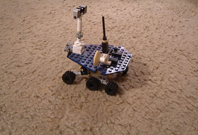 The Rover Opportunist, roving along a vast carpeted wasteland
